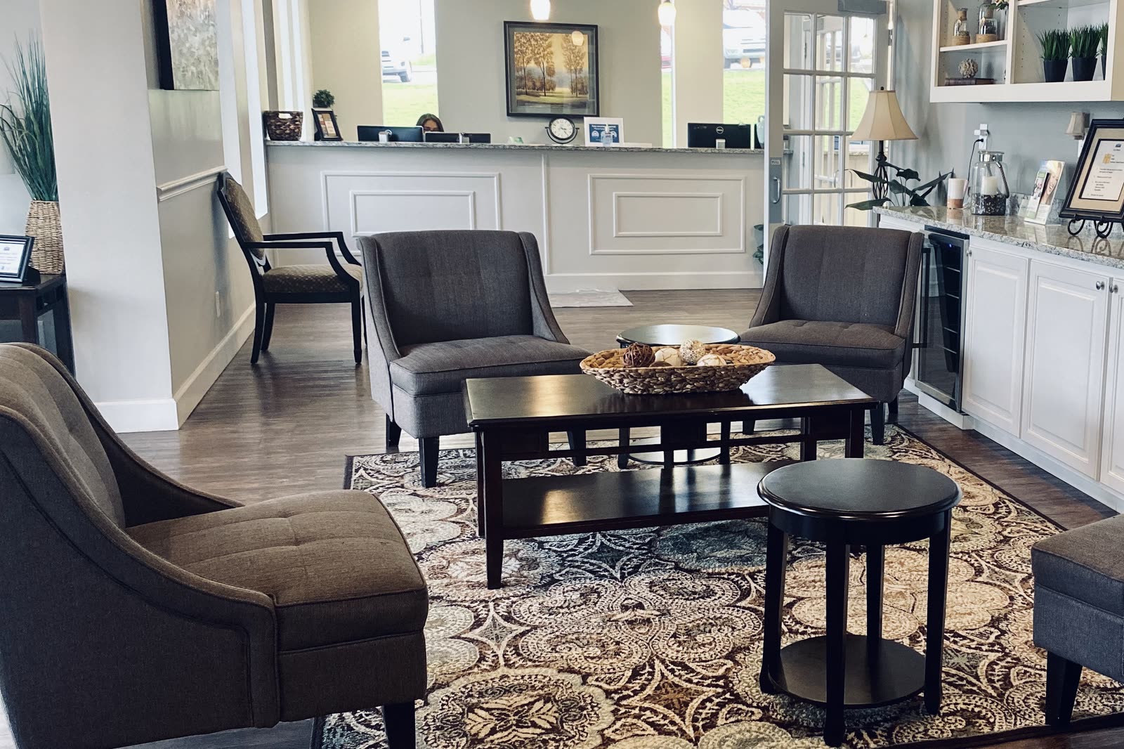 Seating area with armchairs and a low table in front of the reception desk